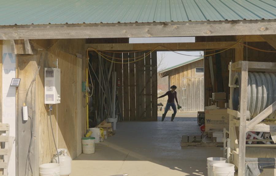 person closing barn door